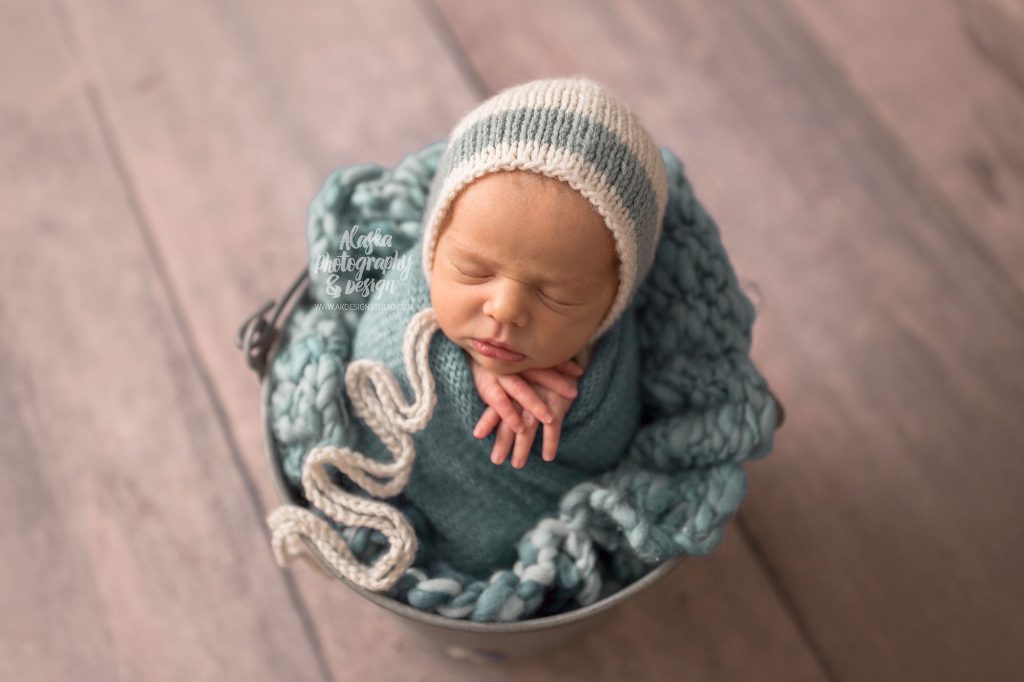 Newborn baby boy in light blue