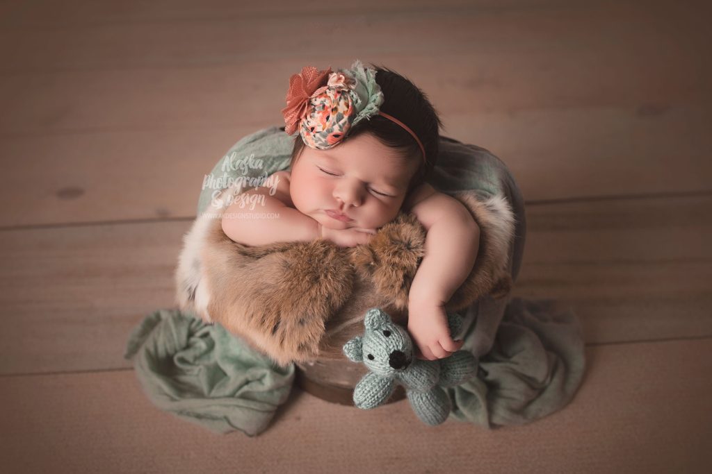 Newborn Baby and a teddy bear