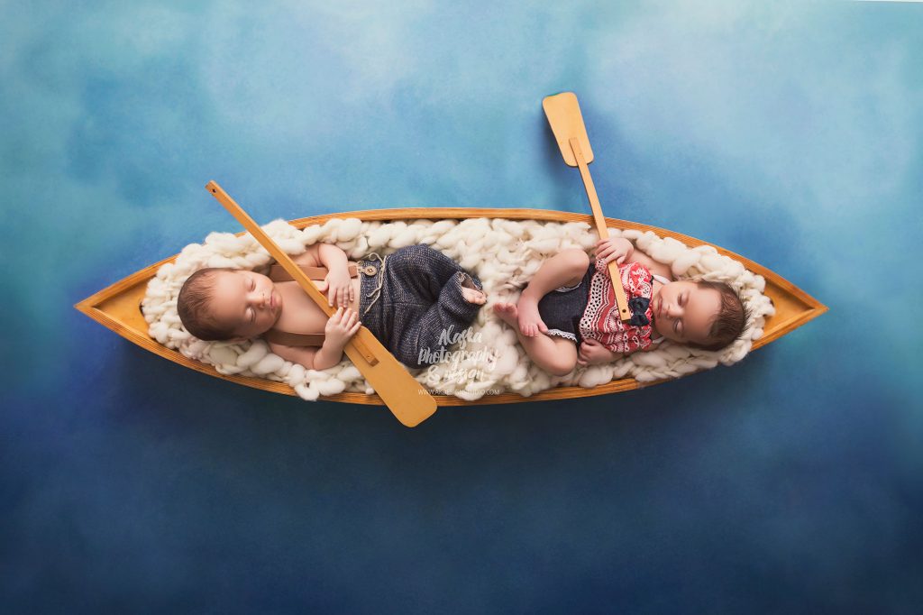 Twin Newborn babies in a canoe